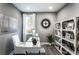 Stylish home office with modern desk, shelving, and decor in neutral tones at 719 Crossroad Ct, Powder Springs, GA 30127