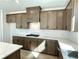 Well-equipped kitchen with gray cabinets, modern appliances, and a white subway tile backsplash at 719 Crossroad Ct, Powder Springs, GA 30127