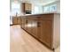 Spacious kitchen island featuring wood cabinets, modern hardware, and a light countertop at 719 Crossroad Ct, Powder Springs, GA 30127