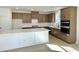 Spacious kitchen with a central island, modern appliances, and custom wooden cabinetry at 719 Crossroad Ct, Powder Springs, GA 30127