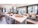 Modern kitchen with quartz countertops, stainless steel appliances, and an adjacent dining area and living room at 719 Crossroad Ct, Powder Springs, GA 30127