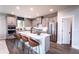 Modern kitchen with stainless steel appliances and a large center island with bar stool seating at 719 Crossroad Ct, Powder Springs, GA 30127