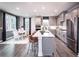 Open kitchen with a large center island with bar seating, and a stainless steel refrigerator at 719 Crossroad Ct, Powder Springs, GA 30127