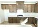Bright kitchen with stainless steel appliances, modern countertops and ample cabinet storage at 719 Crossroad Ct, Powder Springs, GA 30127