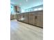 Spacious kitchen island featuring wood cabinets, modern hardware, and a light countertop at 719 Crossroad Ct, Powder Springs, GA 30127