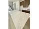 Bright kitchen featuring a large white island with stone countertops and wooden cabinets at 719 Crossroad Ct, Powder Springs, GA 30127