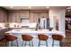 Spacious kitchen with stainless steel appliances, quartz counters, and pendant lighting above a center island at 719 Crossroad Ct, Powder Springs, GA 30127