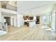Spacious open-concept floor plan with a modern kitchen, dining, and living area, filled with natural light at 719 Crossroad Ct, Powder Springs, GA 30127