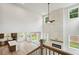 Open concept living space with a soaring fireplace and large windows overlooking the backyard at 719 Crossroad Ct, Powder Springs, GA 30127