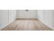 Inviting living room featuring wainscoting, hardwood floors, and plenty of natural light at 719 Crossroad Ct, Powder Springs, GA 30127