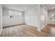 Inviting living room featuring wainscoting, hardwood floors, and plenty of natural light at 719 Crossroad Ct, Powder Springs, GA 30127