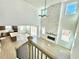 Spacious living room with stone fireplace, soaring ceilings, and an open concept kitchen at 719 Crossroad Ct, Powder Springs, GA 30127