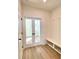Functional mudroom with built in bench, storage and french doors leading to another room at 719 Crossroad Ct, Powder Springs, GA 30127