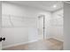 Spacious walk-in closet with built-in shelving for ample storage at 719 Crossroad Ct, Powder Springs, GA 30127