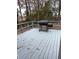Spacious back deck with grey painted wood and a charcoal grill, perfect for outdoor entertaining at 980 Fox Chase Ln, Riverdale, GA 30296
