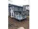 Two story home with a backyard deck and balcony at 980 Fox Chase Ln, Riverdale, GA 30296