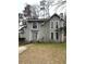 Charming two-story home with gray siding, black trim, and a well-maintained front lawn in a desirable neighborhood at 980 Fox Chase Ln, Riverdale, GA 30296