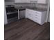 Close-up of updated kitchen with stainless steel appliances, granite countertops, and ample cabinet space at 980 Fox Chase Ln, Riverdale, GA 30296