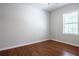 Empty bedroom features hardwood floors, white walls, and ample natural light at 1104 Victory Sw Dr, Atlanta, GA 30310