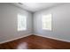 This bedroom is bright with wood-look floors and features two windows with views at 1104 Victory Sw Dr, Atlanta, GA 30310