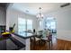 Bright dining room features wood floors, modern lighting, and seamless flow into the living area at 1104 Victory Sw Dr, Atlanta, GA 30310