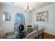 Dining area with a modern glass table, stylish decor, and hardwood floors at 1104 Victory Sw Dr, Atlanta, GA 30310
