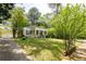 Charming single-story home featuring a lush front lawn and a detached two-car garage at 1104 Victory Sw Dr, Atlanta, GA 30310