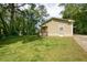 Charming home with a well-maintained lawn, complemented by lush trees and a private driveway at 1104 Victory Sw Dr, Atlanta, GA 30310