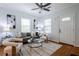 Cozy living room featuring hardwood floors, a comfortable sofa, and ample natural light at 1104 Victory Sw Dr, Atlanta, GA 30310
