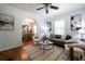 Bright living room with hardwood floors, stylish furniture, and an open archway to the dining area at 1104 Victory Sw Dr, Atlanta, GA 30310