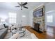 Inviting living room with a stone fireplace, hardwood floors, and comfortable seating at 1104 Victory Sw Dr, Atlanta, GA 30310