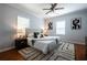 Bright main bedroom features a ceiling fan, modern decor, and ample natural light at 1104 Victory Sw Dr, Atlanta, GA 30310