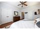 Cozy main bedroom features hardwood floors, closet, dresser, and modern decor at 1104 Victory Sw Dr, Atlanta, GA 30310