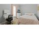 Charming bedroom with a dedicated study area, soft lighting, and cozy carpet at 896 Winn Rd, Douglasville, GA 30134