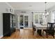 Inviting dining room with hardwood floors, elegant lighting, and access to an outdoor space at 896 Winn Rd, Douglasville, GA 30134