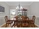 Traditional dining room features hardwood floors, wainscoting, and chandelier at 896 Winn Rd, Douglasville, GA 30134