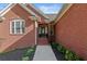 Charming red brick home with beautifully landscaped front entrance at 896 Winn Rd, Douglasville, GA 30134