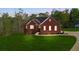 Charming red brick home featuring a well-manicured lawn and lovely landscaping at 896 Winn Rd, Douglasville, GA 30134