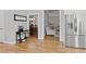 Open kitchen with stainless steel refrigerator and views of the dining area and living room at 896 Winn Rd, Douglasville, GA 30134