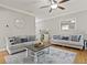Bright living room featuring hardwood floors, a ceiling fan and comfortable furniture at 896 Winn Rd, Douglasville, GA 30134