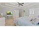 Bright main bedroom features a ceiling fan, neutral decor, and ensuite bathroom access at 896 Winn Rd, Douglasville, GA 30134