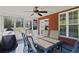 Inviting screened porch with a table and chairs, a ceiling fan, and views of the yard at 896 Winn Rd, Douglasville, GA 30134