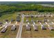 Aerial view of the community and surrounding pond and green space at 1259 Fendt Dr, Locust Grove, GA 30248