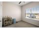 Bedroom featuring window, closet, and carpeted floor at 1259 Fendt Dr, Locust Grove, GA 30248