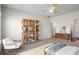 Stylishly decorated bedroom with bookshelf and furnishings, offering a comfortable and inviting personal space at 1259 Fendt Dr, Locust Grove, GA 30248