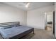 Bedroom with ceiling fan, window, bed and closet door at 1259 Fendt Dr, Locust Grove, GA 30248