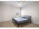 Bedroom featuring a ceiling fan, window, and bed frame with bedding at 1259 Fendt Dr, Locust Grove, GA 30248