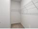 Walk-in closet featuring carpeted floor and upper shelving at 1259 Fendt Dr, Locust Grove, GA 30248