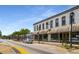 Two-story commercial building with awnings and street parking in front at 1259 Fendt Dr, Locust Grove, GA 30248