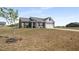 Charming brick home featuring stone accents, a two-car garage, and a well-manicured lawn at 1259 Fendt Dr, Locust Grove, GA 30248